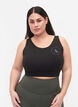 CORE, MID SUPPORT SPORTS BRA - Sports-BH med V-skjæring på ryggen, Black, Model image number 0