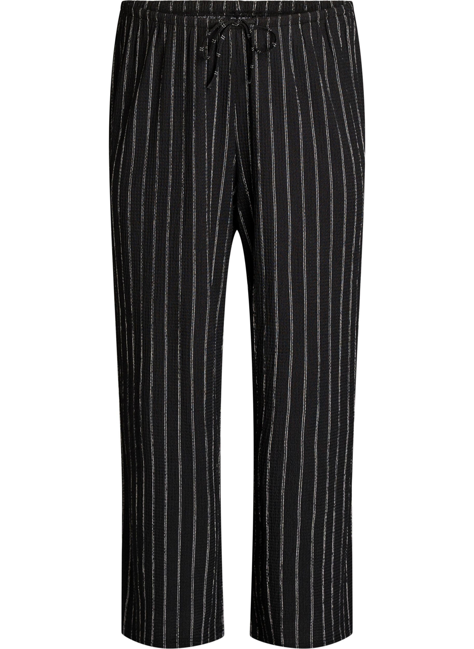 Bukser med vide ben i et lett teksturert stoff