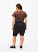 Tettsittende treningshorts med lommer, Svart, Model image number 2