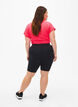 Tettsittende treningshorts med lomme, Black, Model image number 1