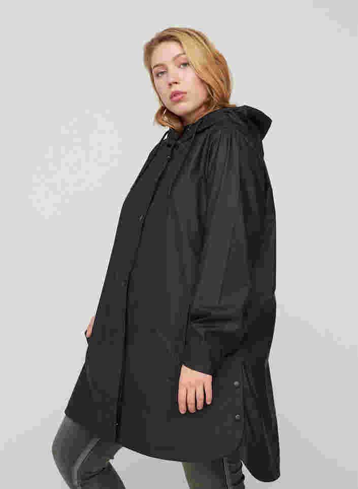 Regnjakke med hette og lommer, Black, Model image number 0