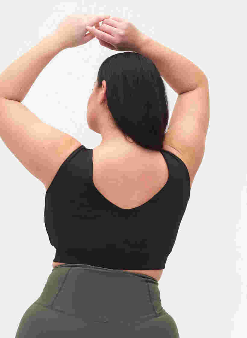 Ensfarget sports-BH med V-skjæring på ryggen, Black, Model image number 1