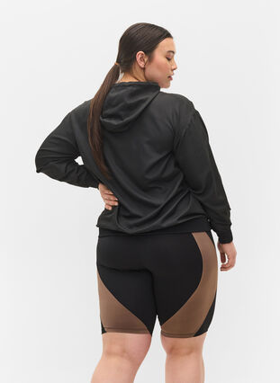 Tettsittende treningsshorts, Black w. Deep Taupe, Model image number 1