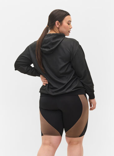 Tettsittende treningsshorts, Black w. Deep Taupe, Model image number 1