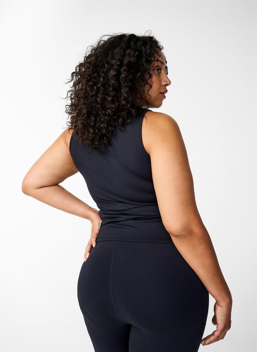 Tettsittende treningstopp med silikonkant på innsiden, Black, Model image number 1