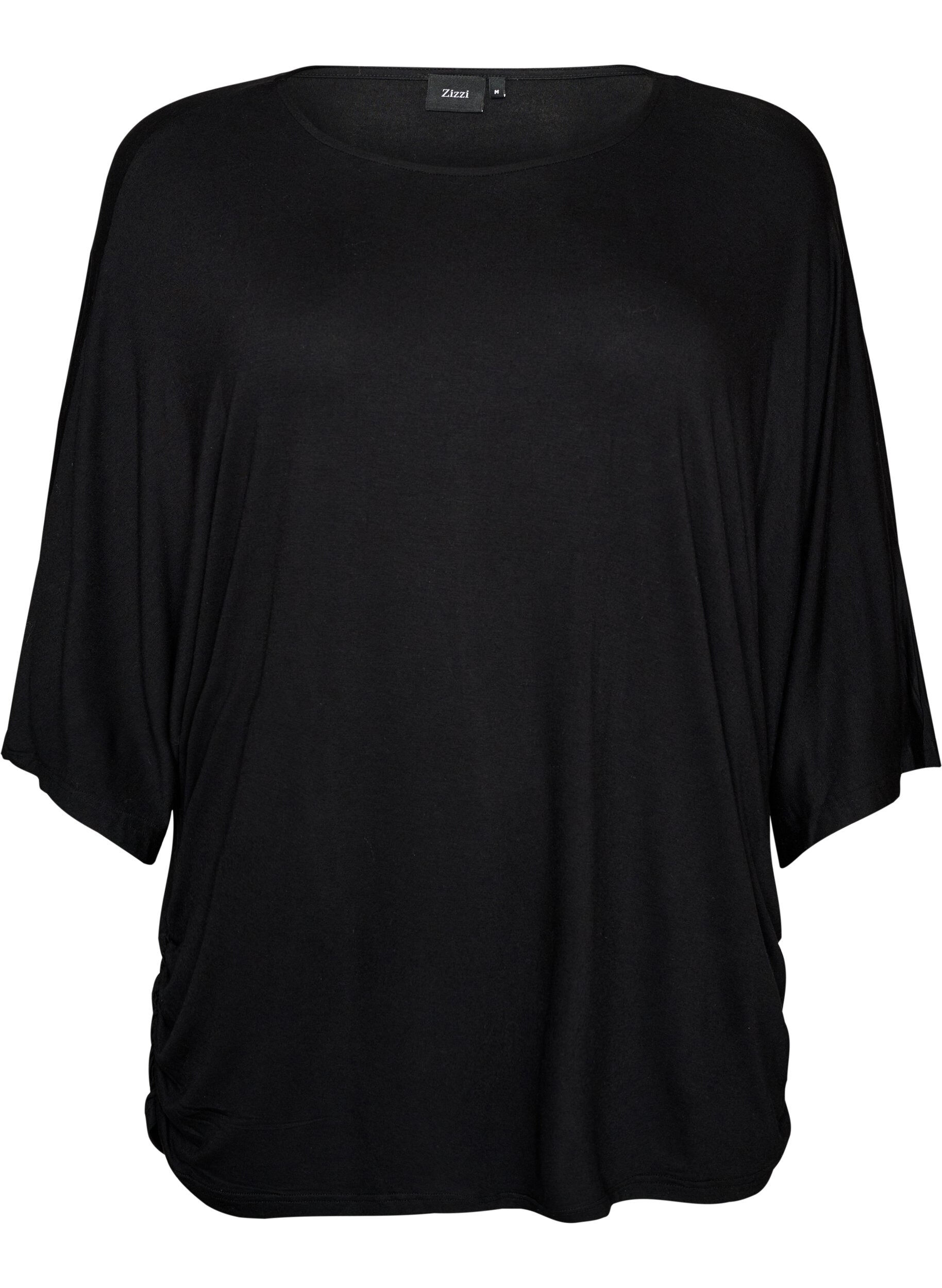 Jerseybluse med albuelange ballongermer