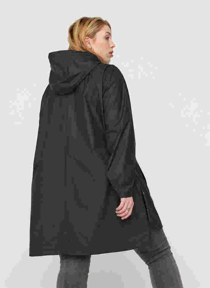 Regnjakke med hette og lommer, Black, Model image number 1