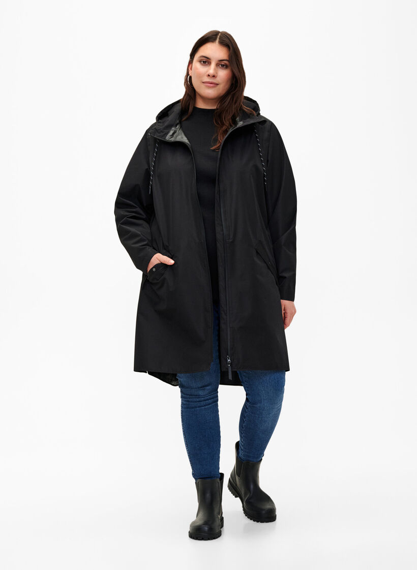 Regnjakke med lommer og hette, Svart, Model image number 1