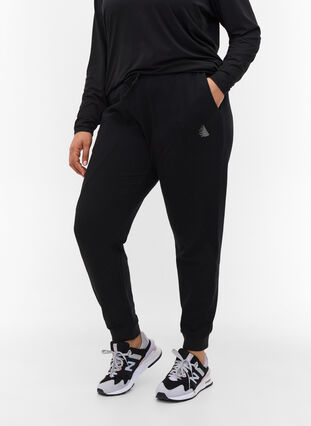 Ensfargede treningsbukser med lommer, Black, Model image number 2