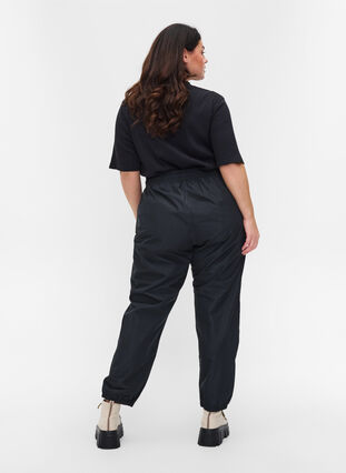 Regnbukser med strikk og knyting, Black, Model image number 1