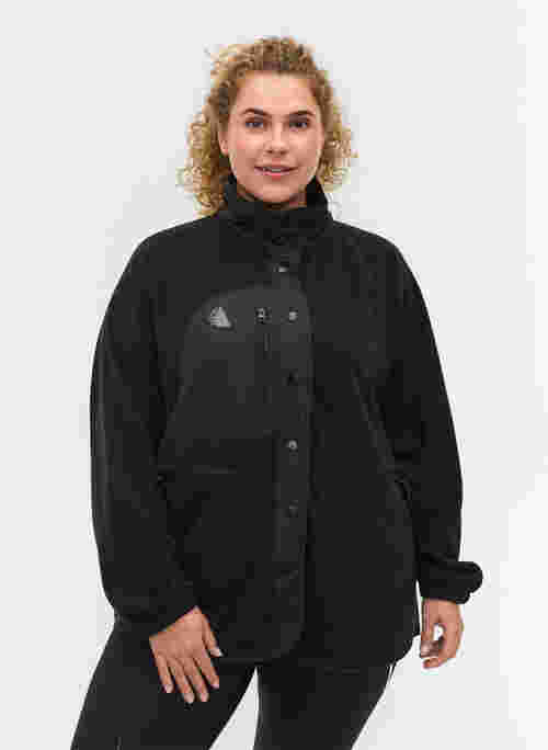 Treningsjakke i fleece med høy hals og lommer
