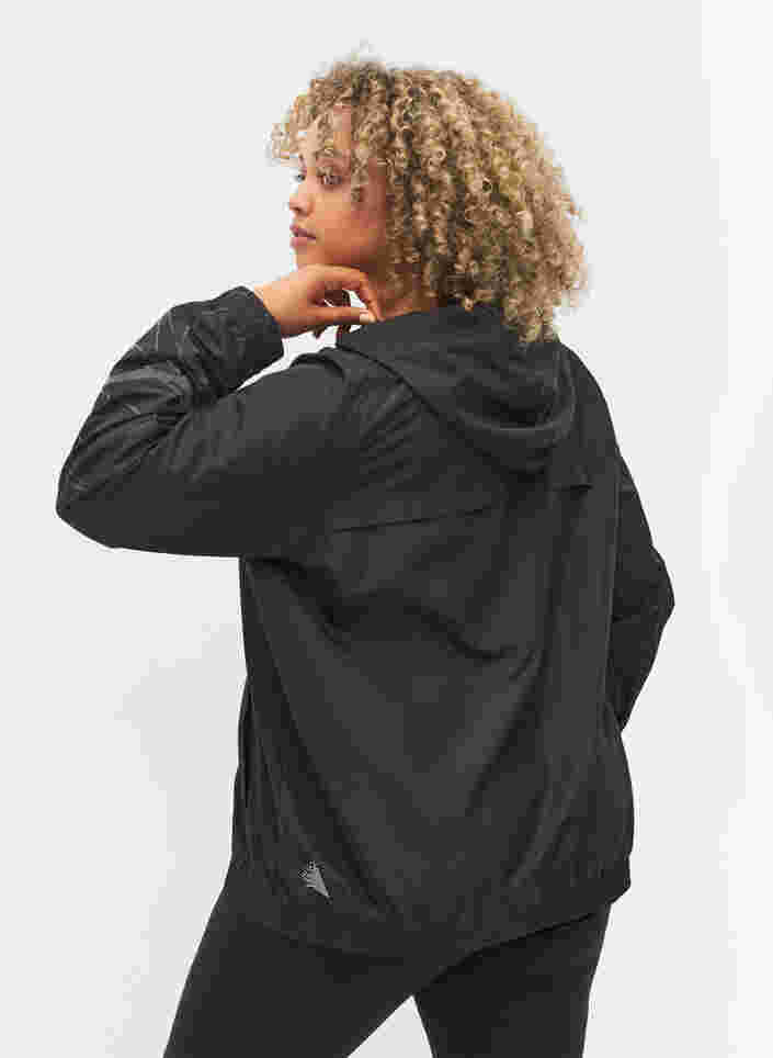 Treningsjakke med glidelås og refleks, Black, Model image number 1