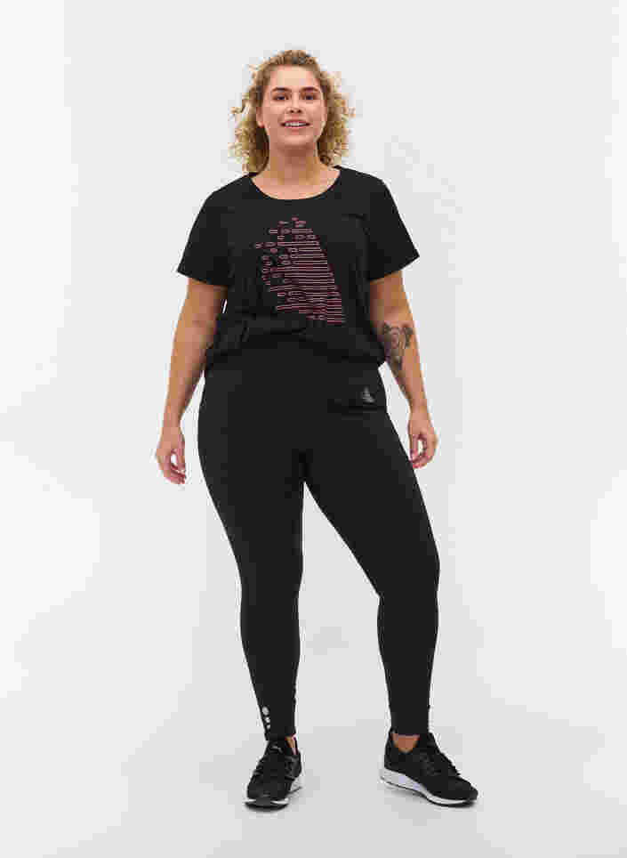 Cropped treningstights med lomme og refleks, Black, Model image number 0