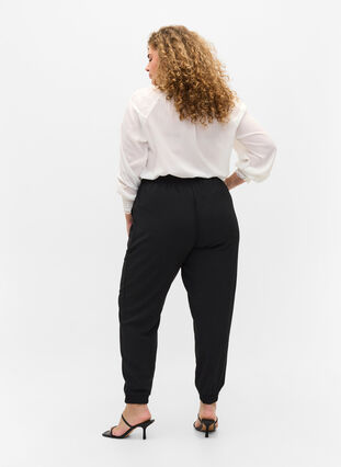 Bukser med lommer og strikkant, Black, Model image number 1