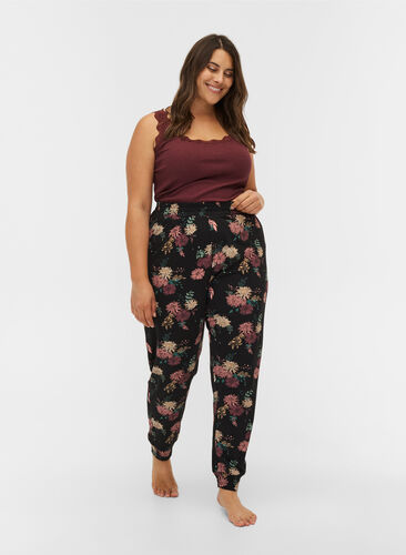 Mønstrete pysjamasbukser i økologisk bomull, Black AOP Flower, Model image number 0