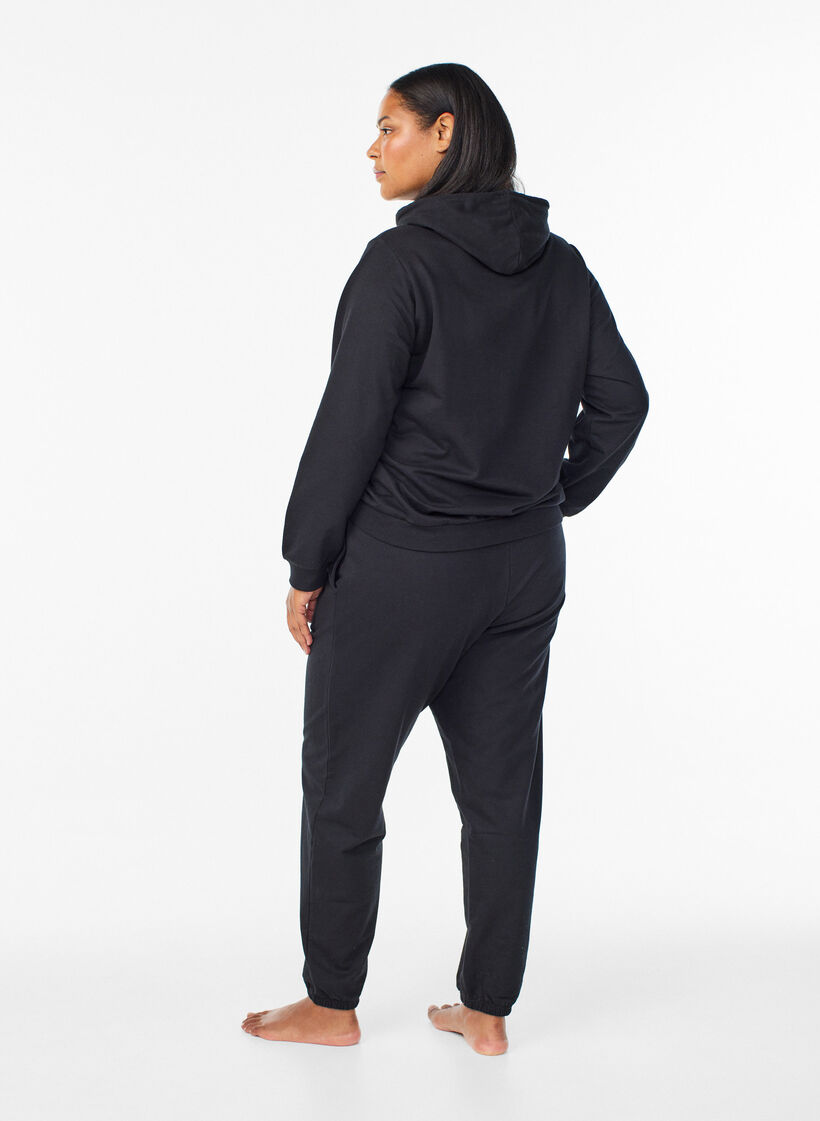 Joggebukser med lommer, Svart, Model image number 1