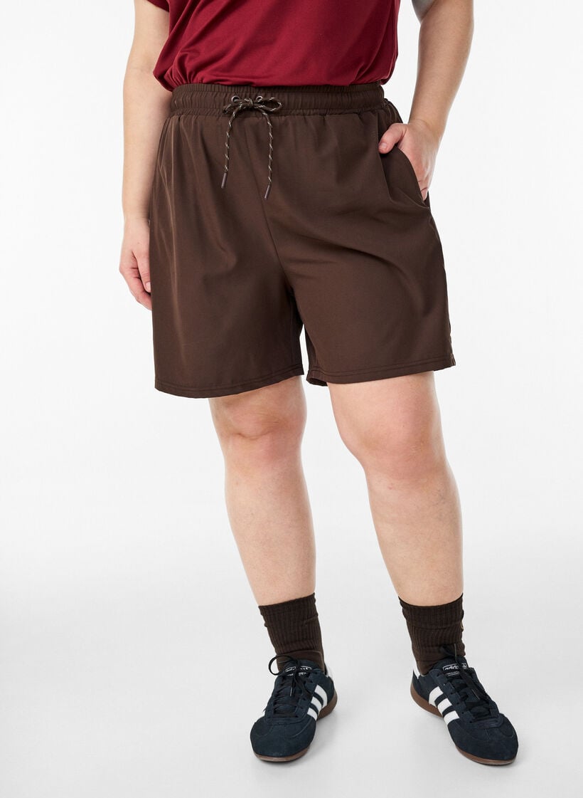 Treningsshorts med innershorts og en lomme til telefonen, Brun, Model image number 0