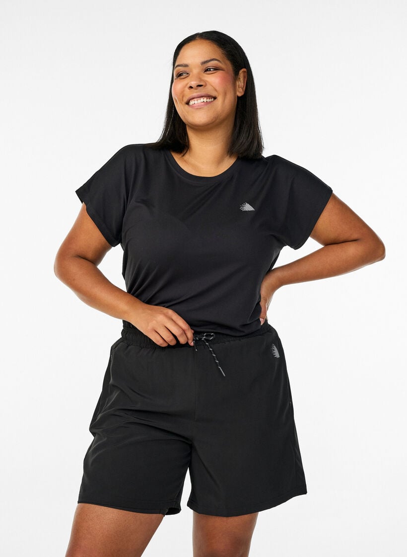 Treningsshorts med innershorts og en lomme til telefonen, Svart, Model image number 0