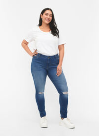 Super slim Sanna jeans med slitte detaljer, Blue denim, Model