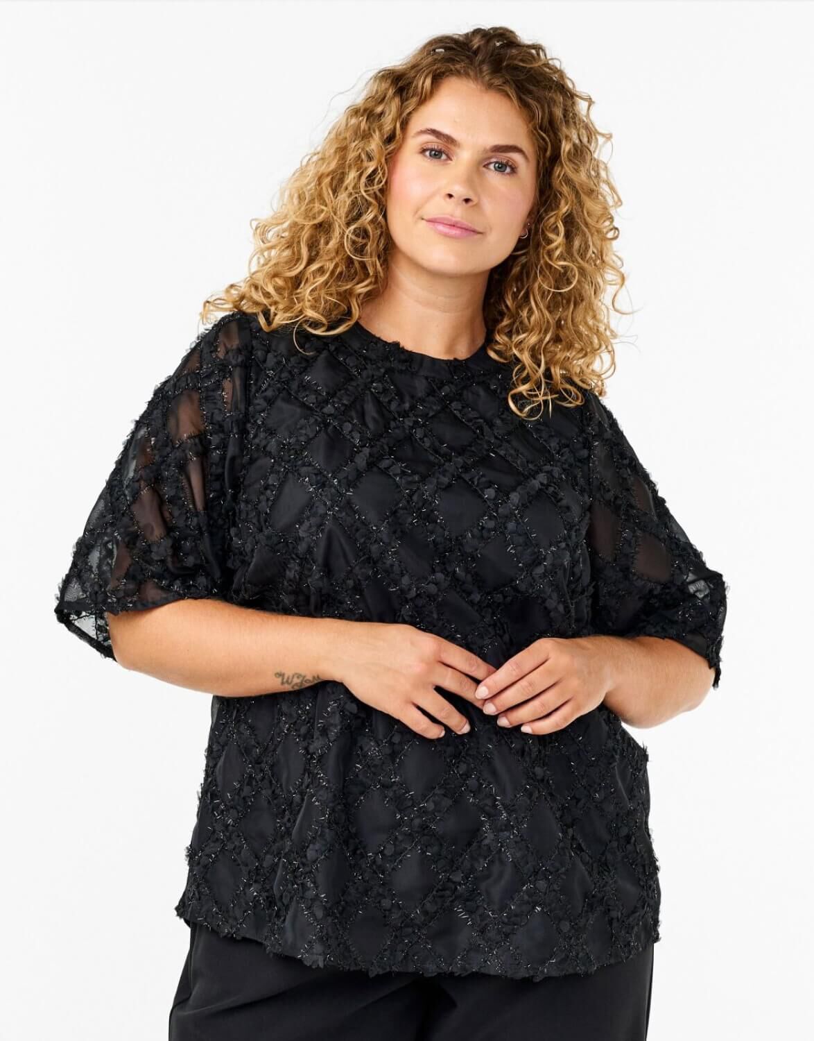 Lilla kortermede bluser